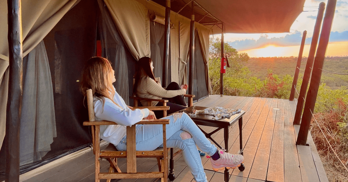 Couple enjoying sundowners on a luxury safari in Africa with Daylight Adventures-min